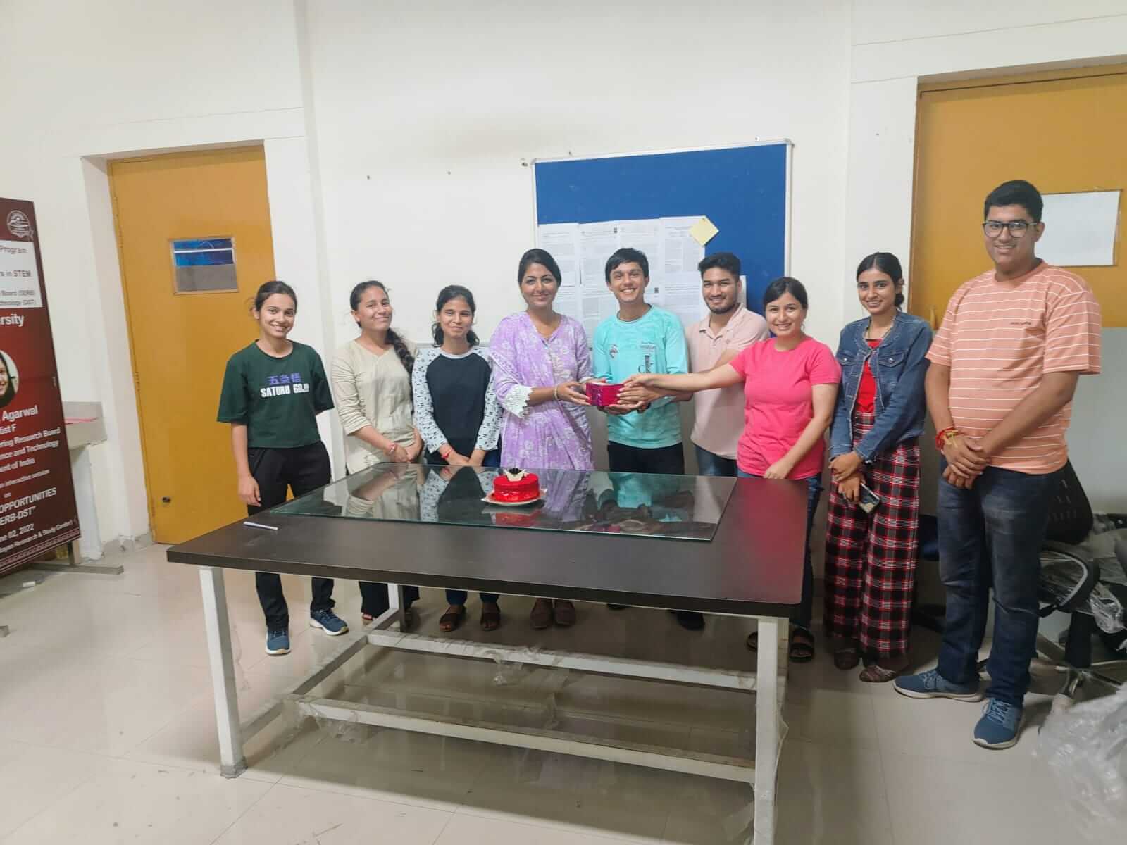 group photo of ACSR with cake